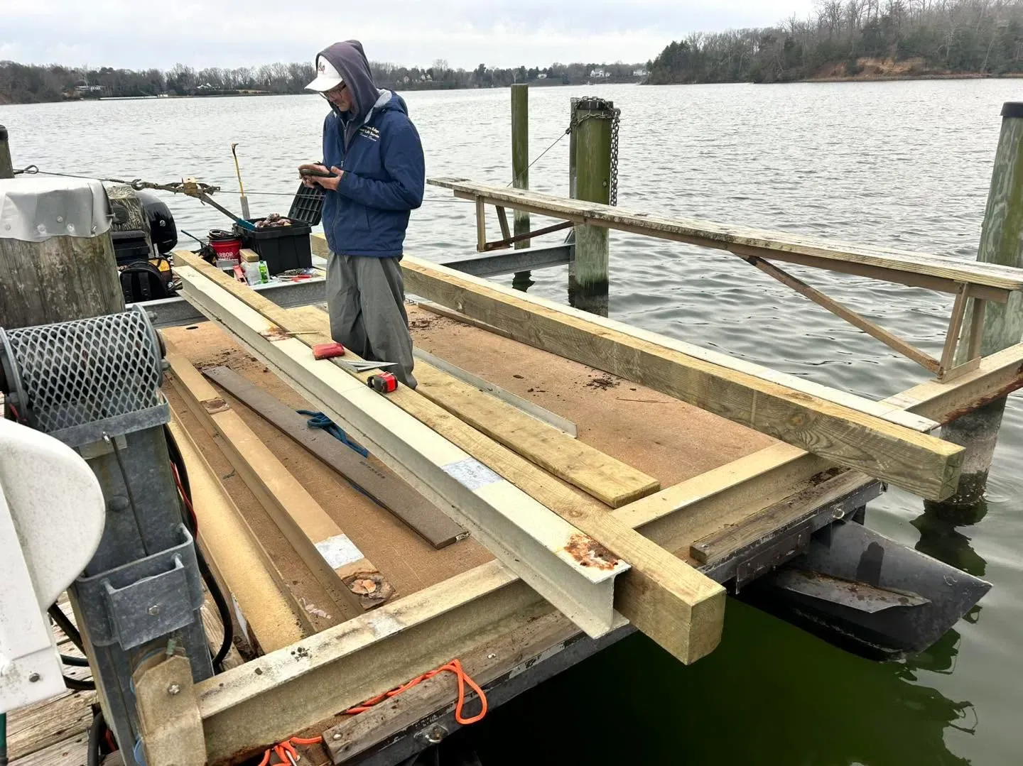 Technician building bunks on a dock