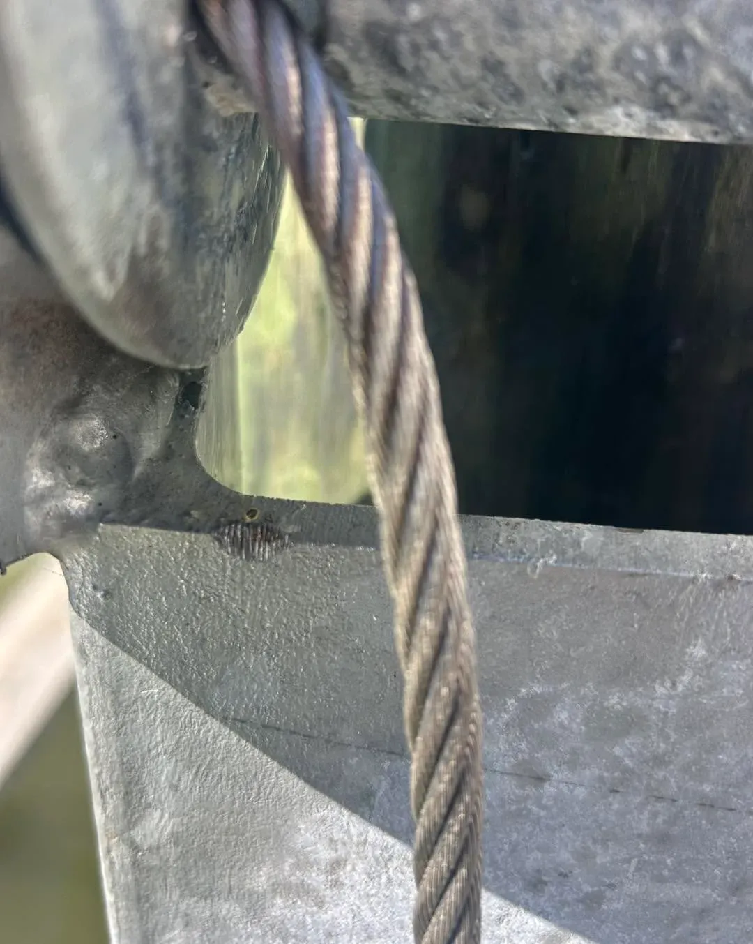 Worn cable running past the lift beam