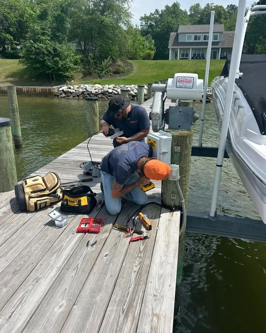 Crew wiring a lift control on the dock