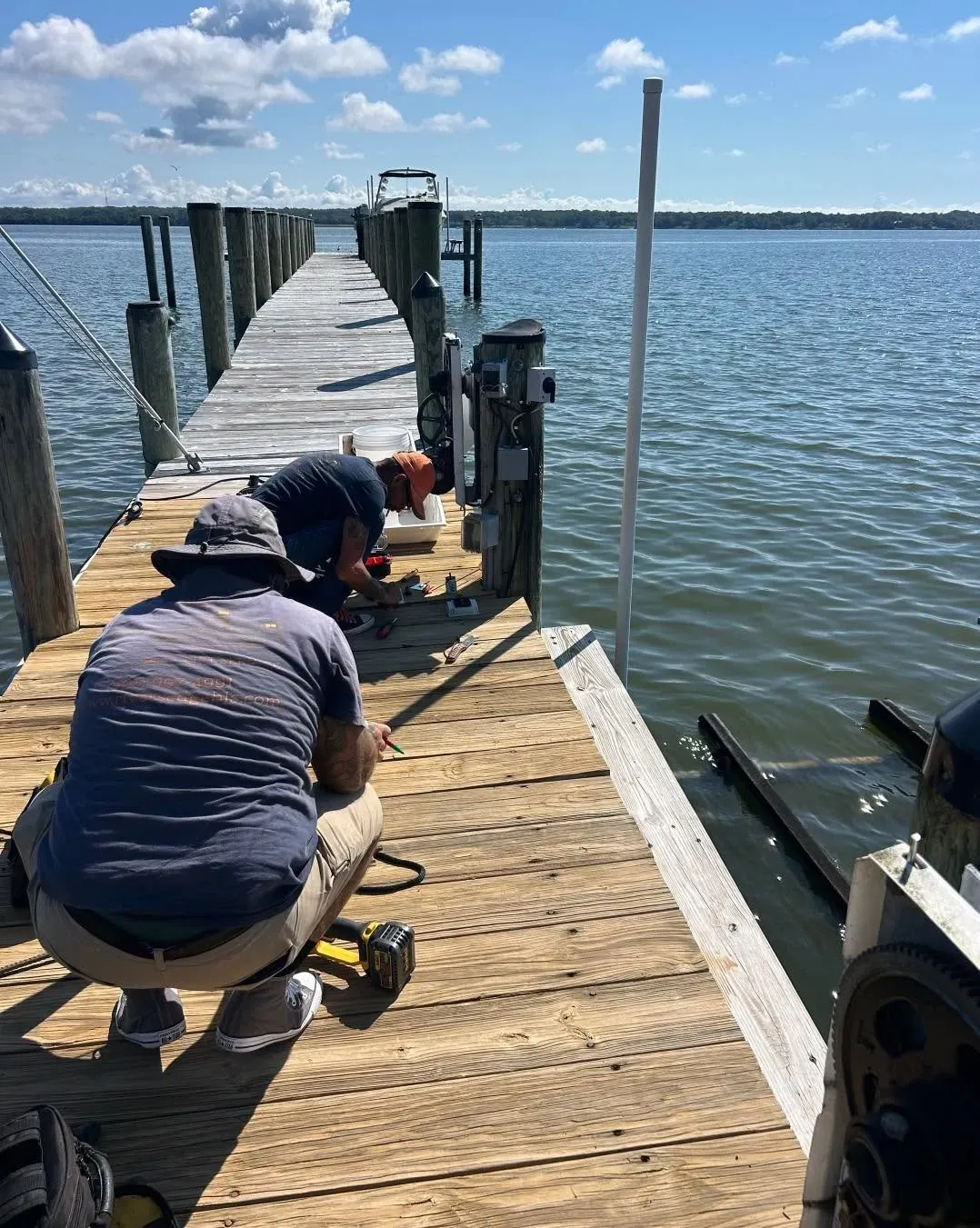 Crew working at the end of a long pier