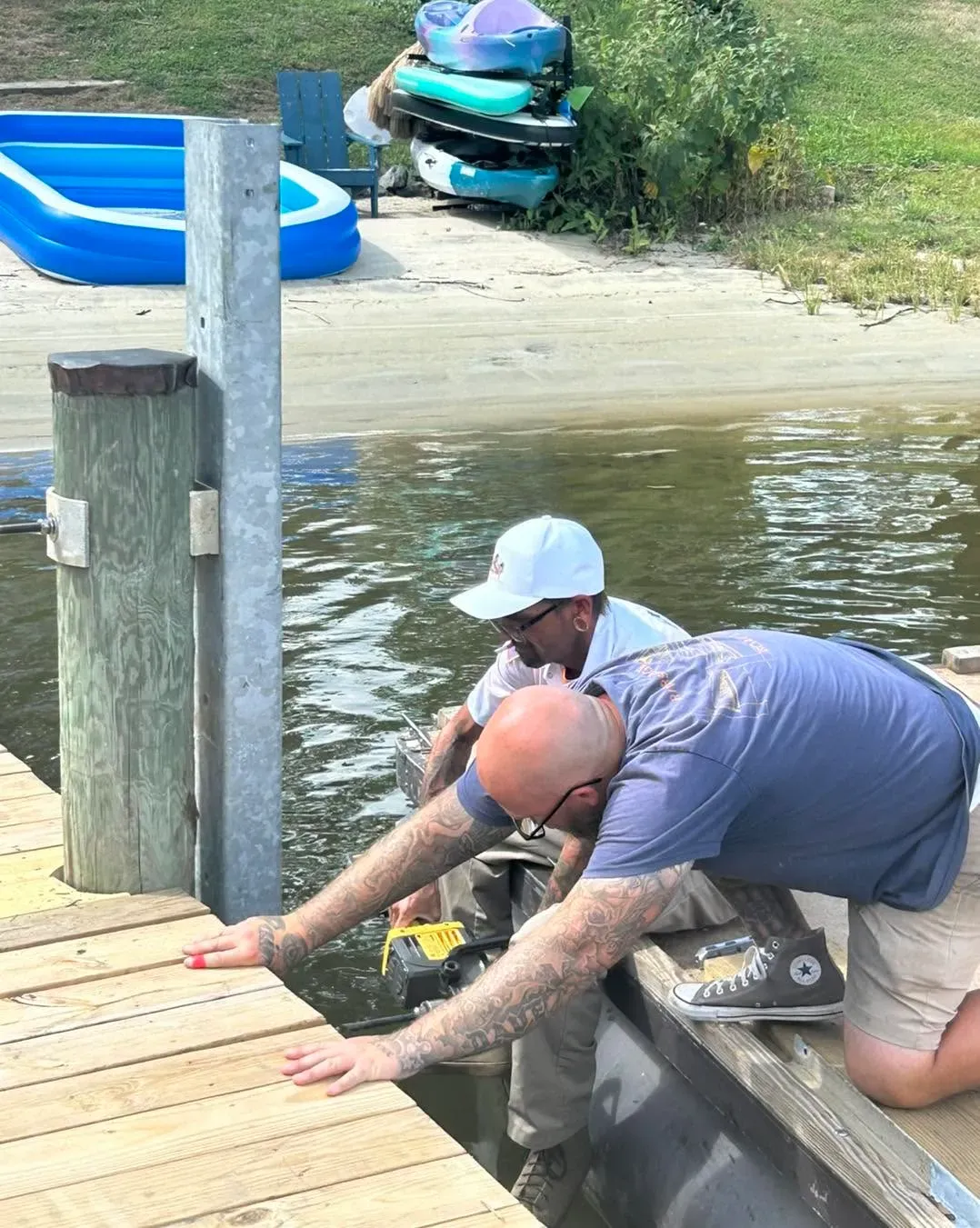 Crew converting a ramp into a kayak launch
