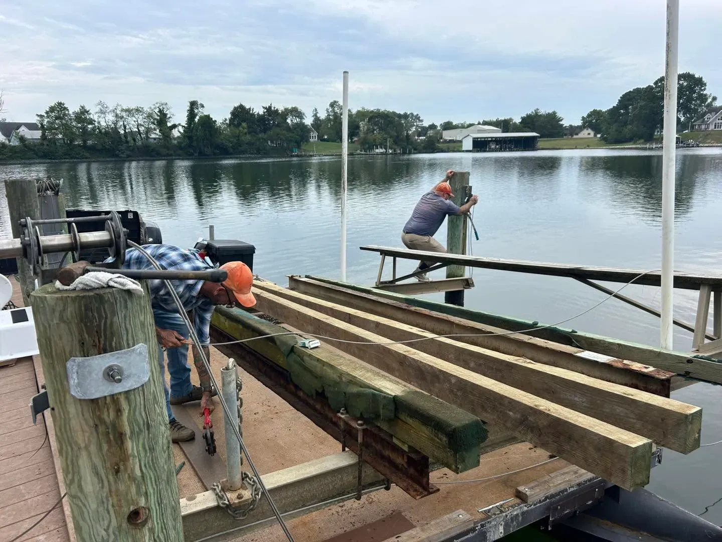 Crew staging bunk lumber on a dock