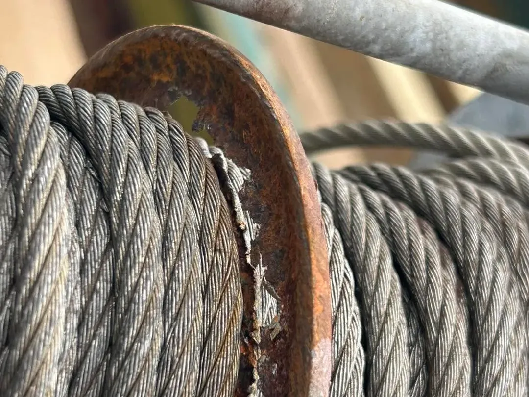Frayed, rusted cable on a lift drum