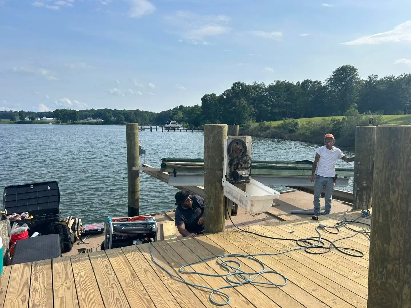 Crew installing a lift at a pier