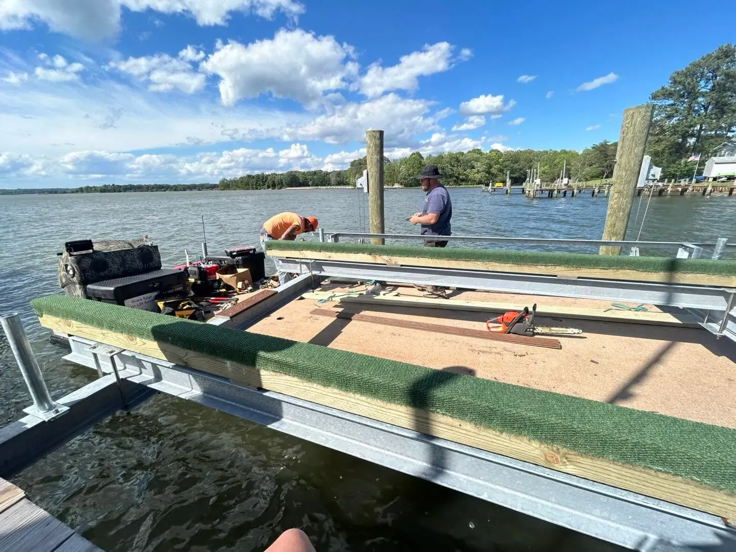Pontoon cradle with new carpeted bunks on the dock