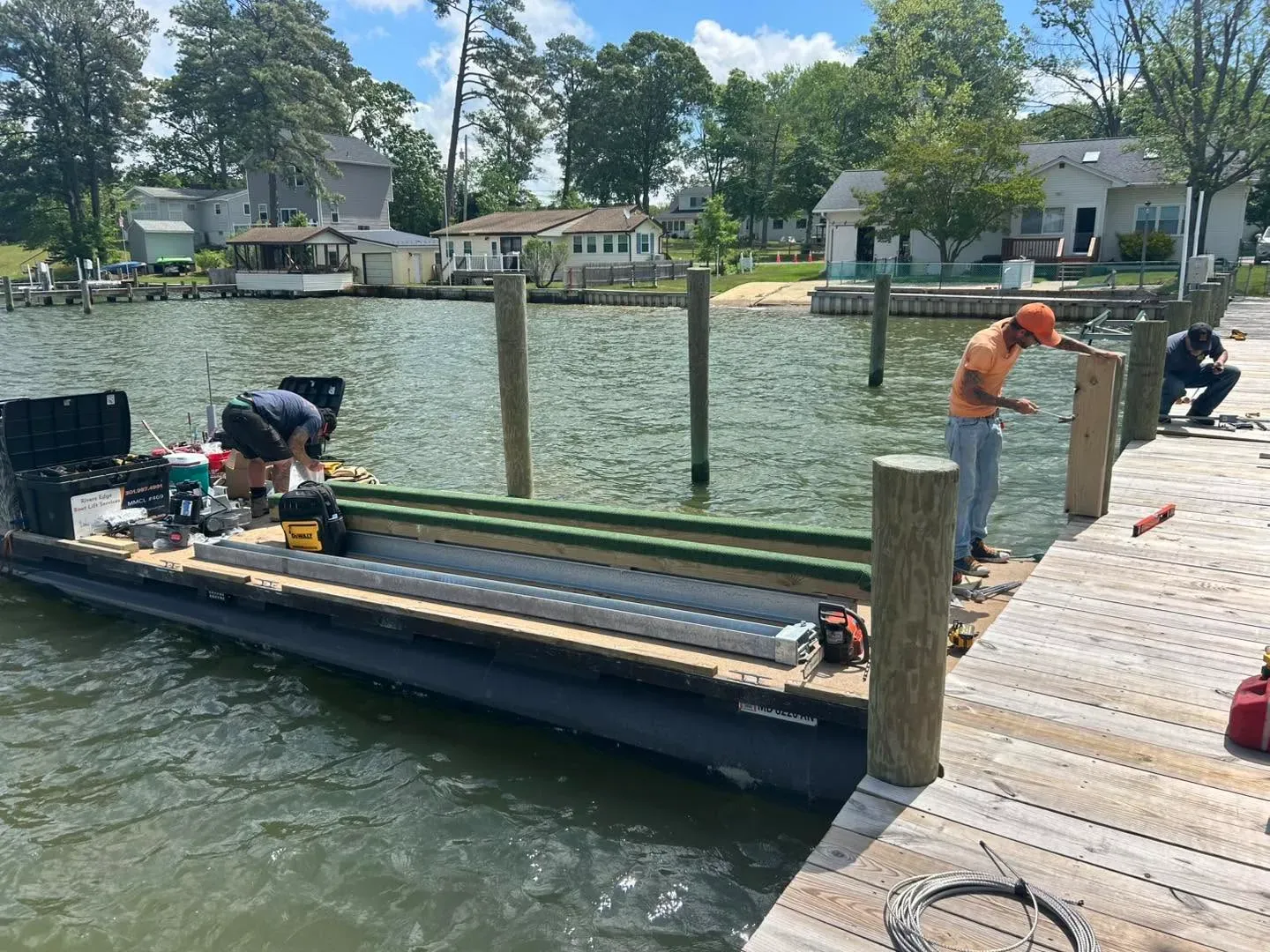 Pontoon cradle staged on a pier by the river