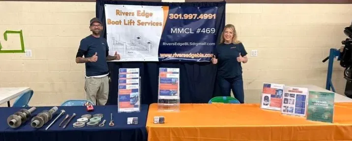 The REBLS team at their booth with lift parts on display